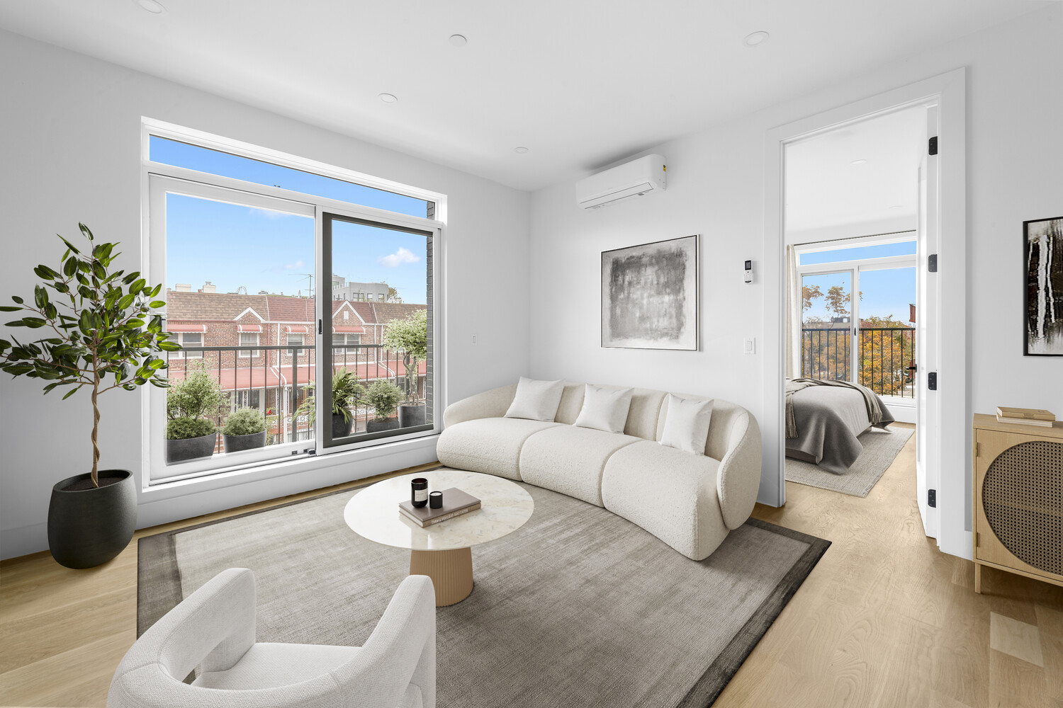 a living room with furniture and a large window