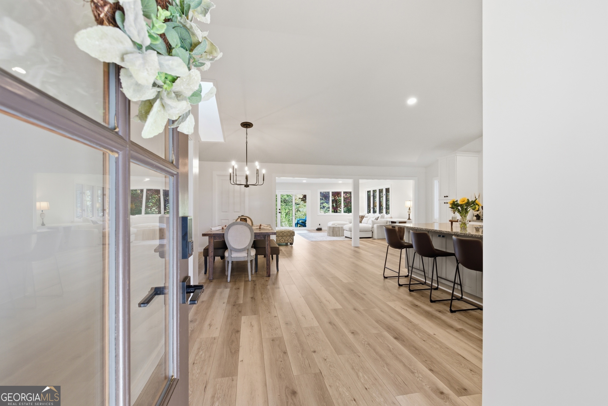 230 Majors Lane Rabun Gap, GA 30568 - Photo 19 of 54 a view of a dining room with furniture a chandelier and wooden floor