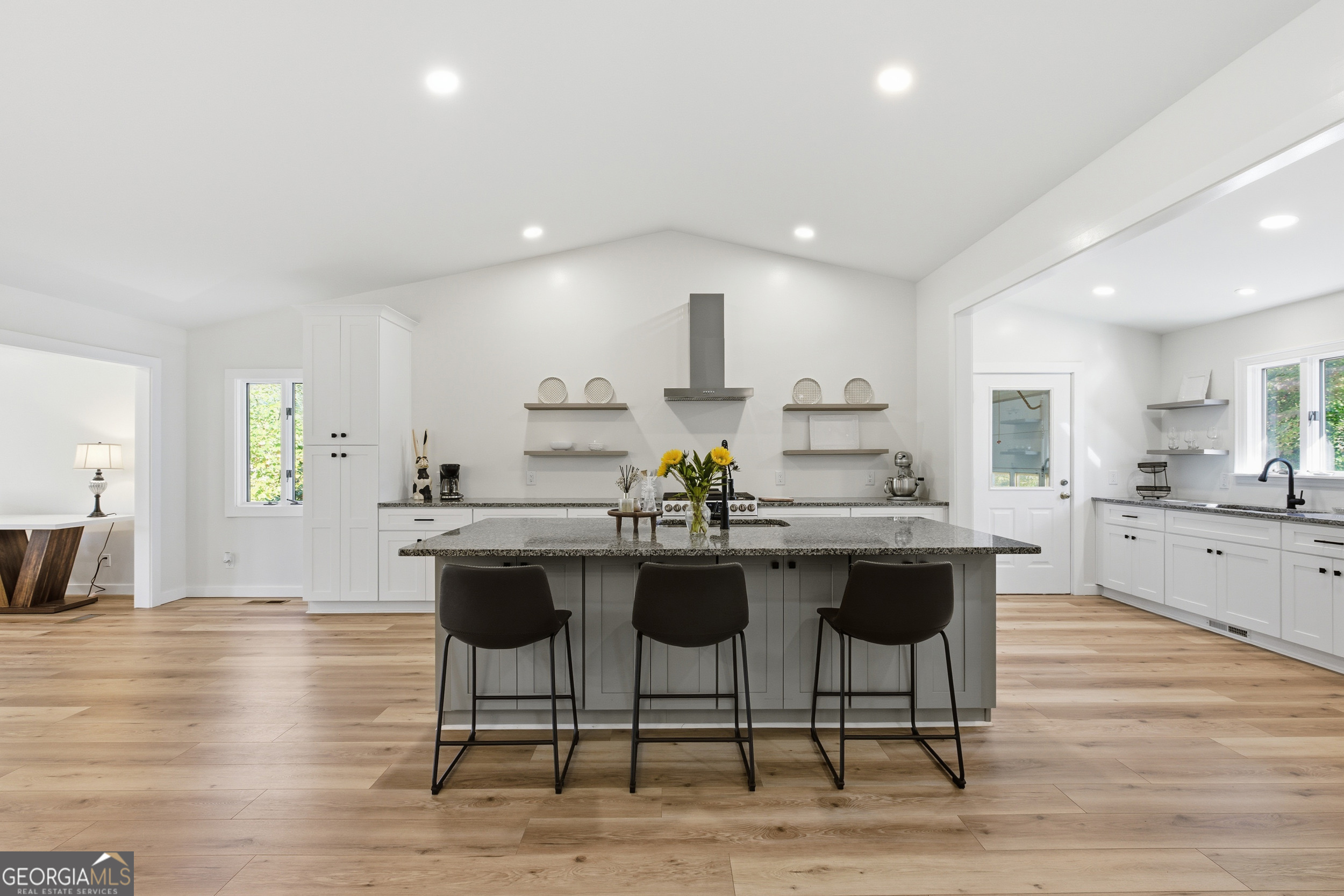 230 Majors Lane Rabun Gap, GA 30568 - Photo 21 of 54 a kitchen with stainless steel appliances granite countertop a kitchen island a stove a cabinets a sink and a chairs