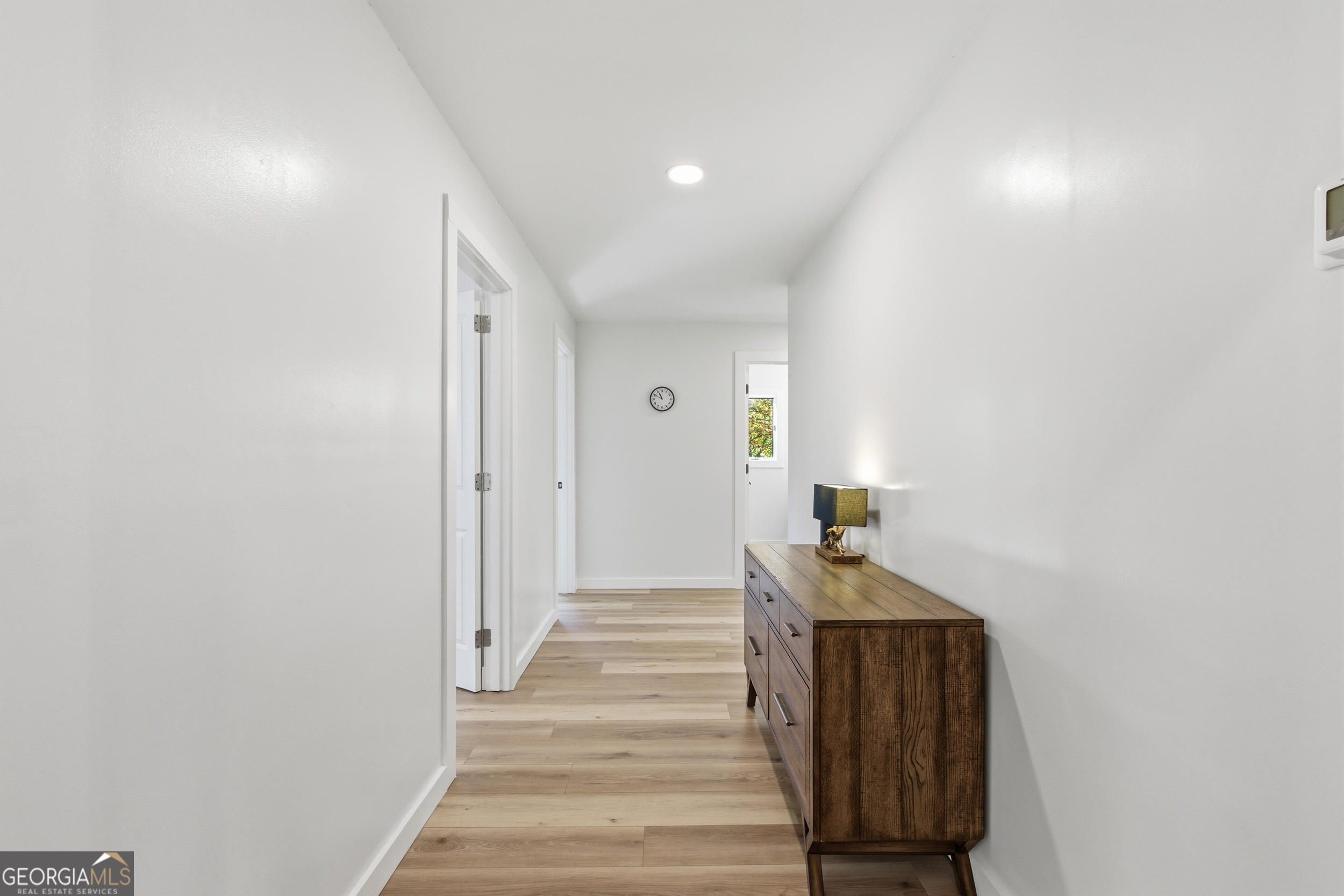 230 Majors Lane Rabun Gap, GA 30568 - Photo 28 of 54 a hallway with stairs and wooden floor