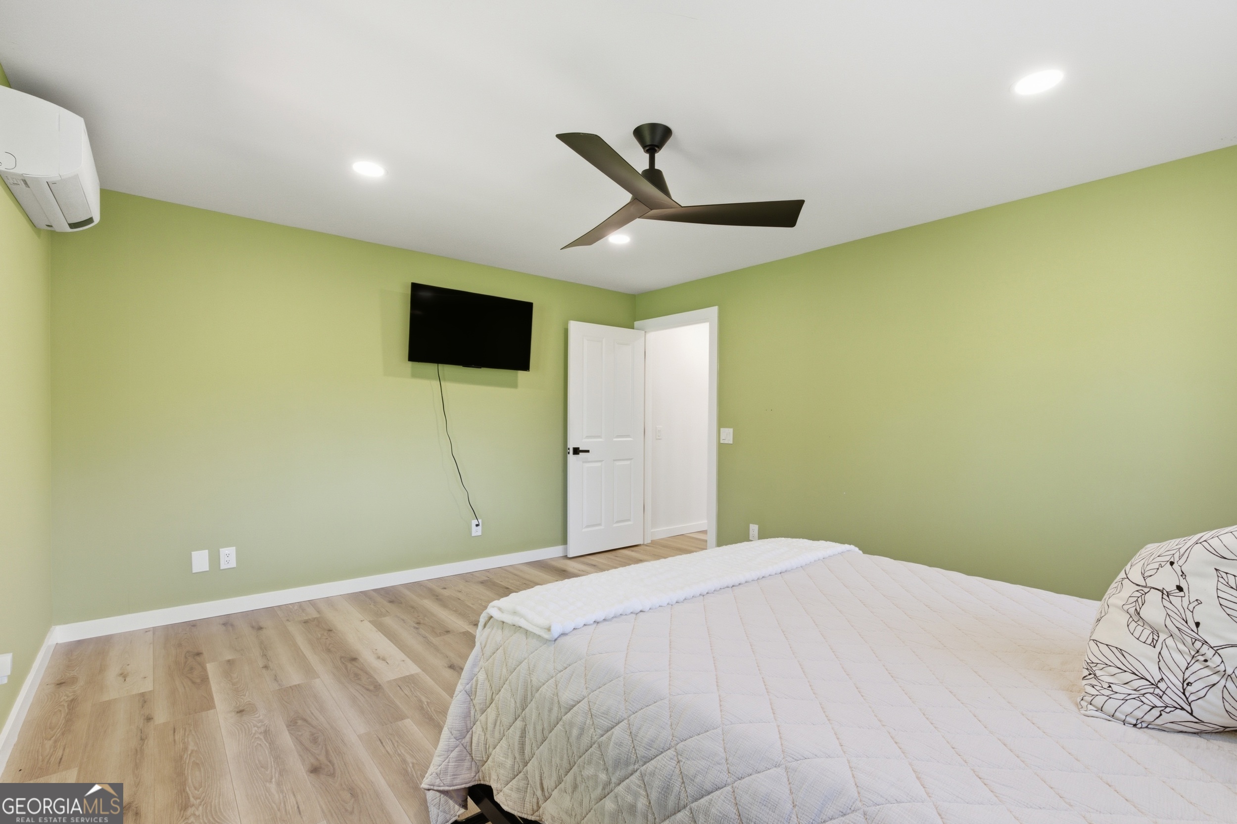 230 Majors Lane Rabun Gap, GA 30568 - Photo 38 of 54 a bedroom with a bed and a flat screen tv