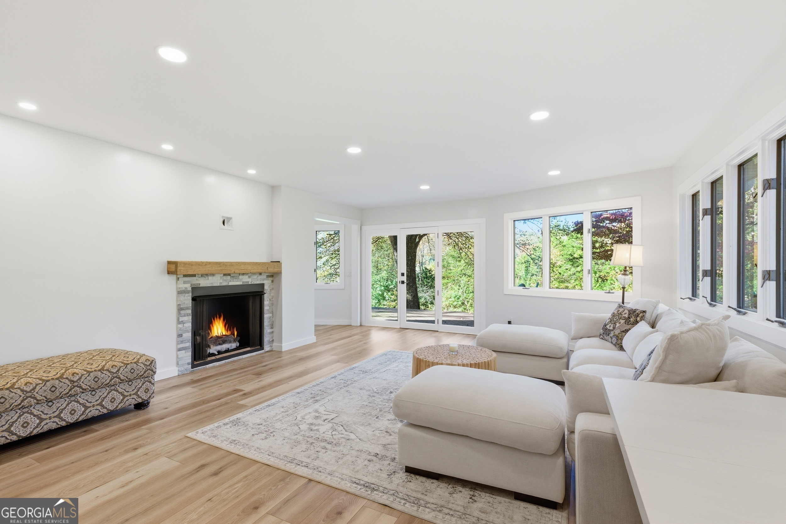 230 Majors Lane Rabun Gap, GA 30568 - Photo 8 of 54 a living room with furniture and a fireplace