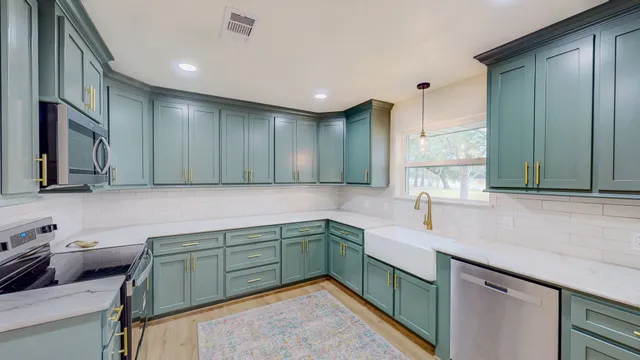 a kitchen with a sink and cabinets