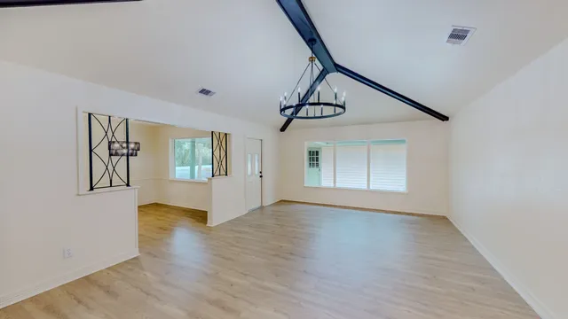 a view of an entryway with wooden floor