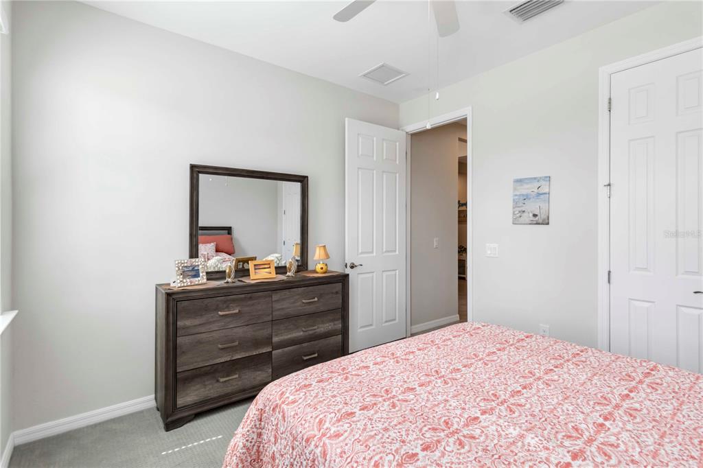 20765 Swallowtail Court Venice, FL 34293 - Photo 20 of 50 a bedroom with a bed and a dresser