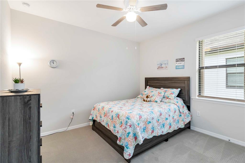 20765 Swallowtail Court Venice, FL 34293 - Photo 22 of 50 a bedroom with a bed and window
