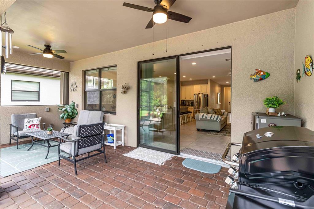 20765 Swallowtail Court Venice, FL 34293 - Photo 27 of 50 a living room with furniture and a chandelier