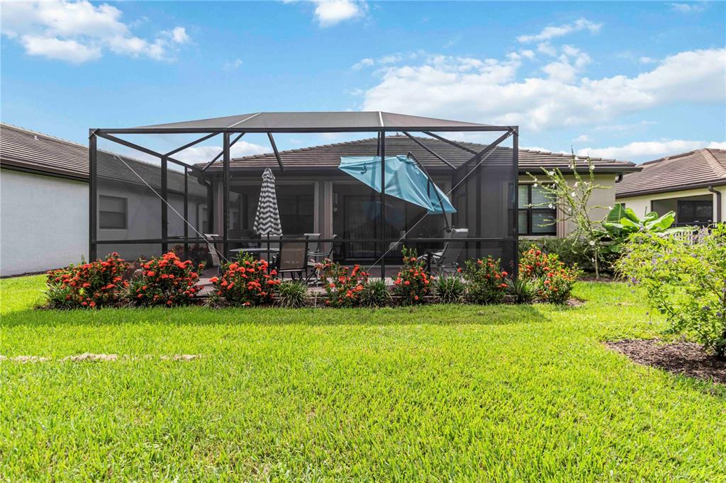 20765 Swallowtail Court Venice, FL 34293 - Photo 30 of 50 a view of a chairs and table in front of house