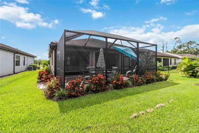 a backyard of a house with lots of green space and garden