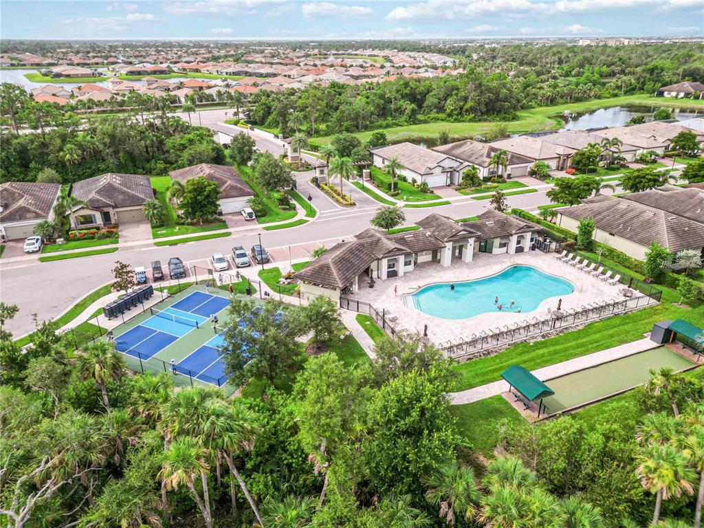 20765 Swallowtail Court Venice, FL 34293 - Photo 35 of 50 an aerial view of residential houses with outdoor space and swimming pool
