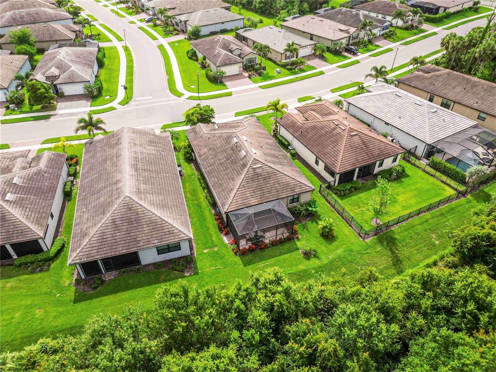 20765 Swallowtail Court Venice, FL 34293 - Photo 48 of 50 an aerial view of a house with a yard and lake view