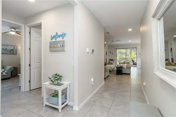 a view of a hallway and dining room
