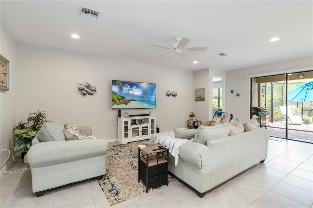 20765 Swallowtail Court Venice, FL 34293 - Photo 7 of 50 a living room with furniture and a flat screen tv