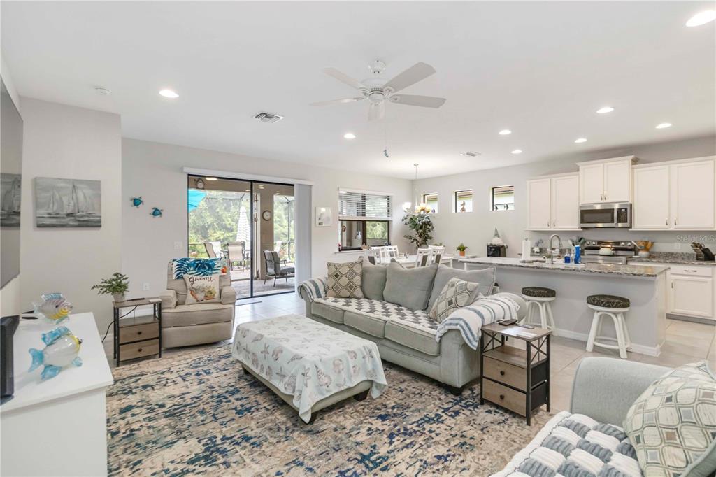 20765 Swallowtail Court Venice, FL 34293 - Photo 8 of 50 a living room with furniture and kitchen view