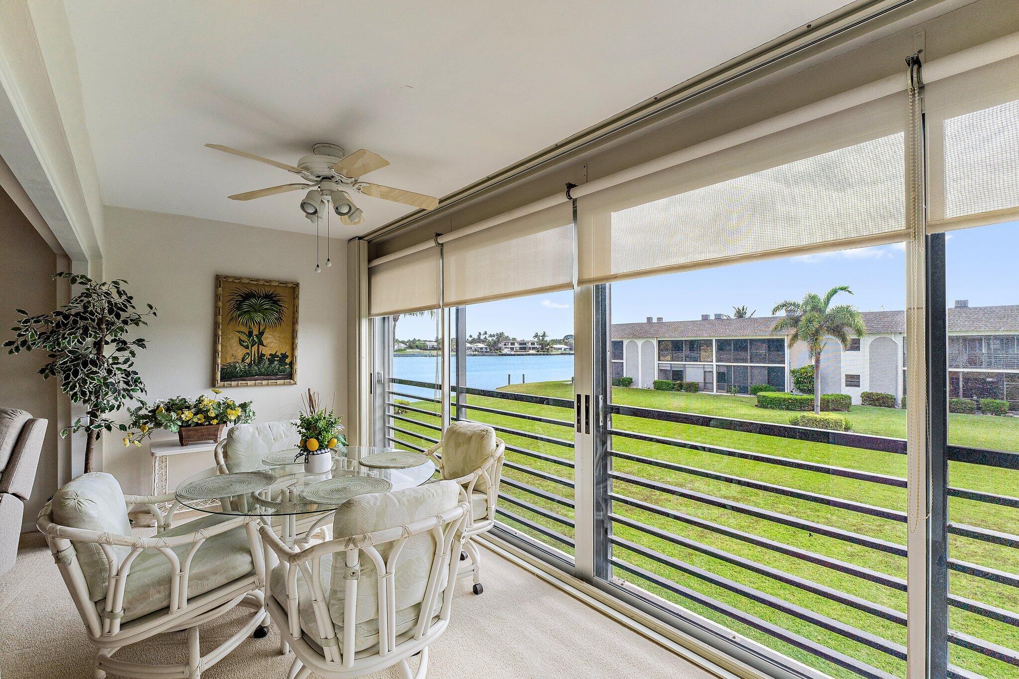 755 Saturn Street, Unit I 206 Jupiter, FL 33477 - Photo 16 of 26 a view of a dining room with furniture window and outside view