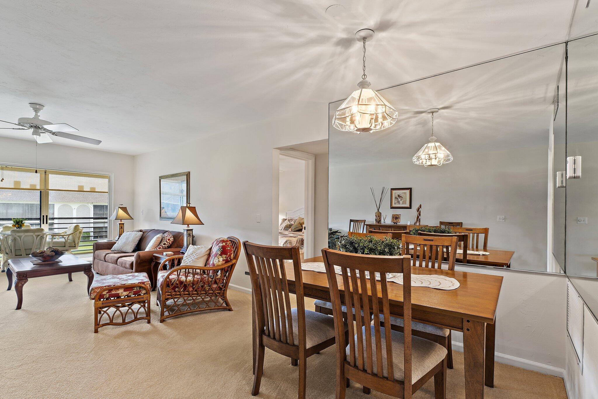 755 Saturn Street, Unit I 206 Jupiter, FL 33477 - Photo 8 of 26 a view of a dining room with furniture window and outside view