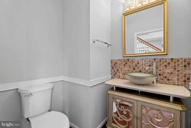 a bathroom with a toilet and a sink