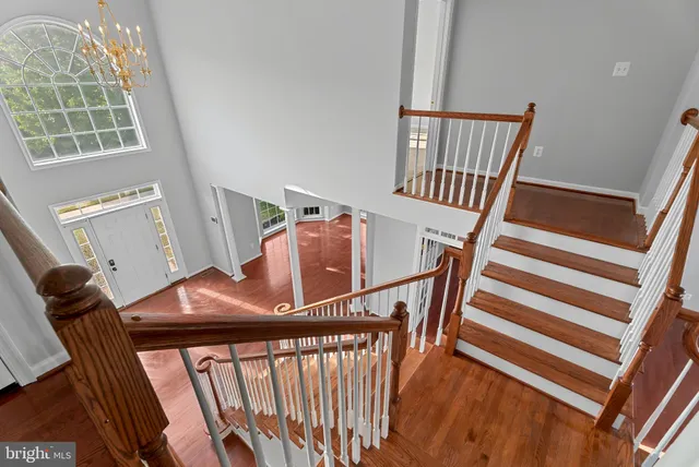 a view of staircase with furniture and window