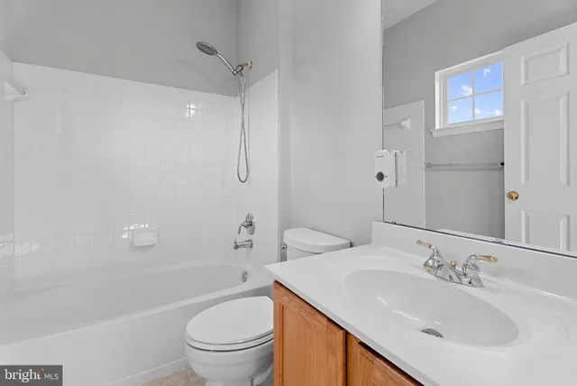 a bathroom with a sink toilet tub and shower