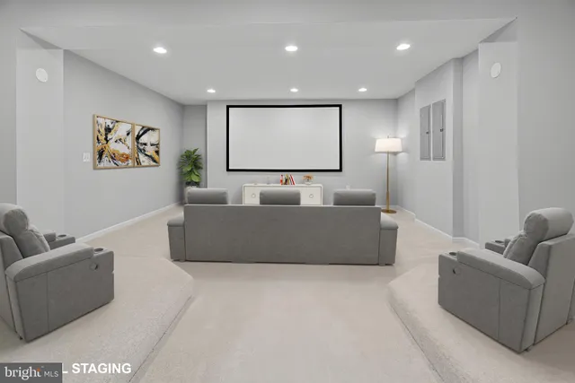 a living room with furniture and wall painting