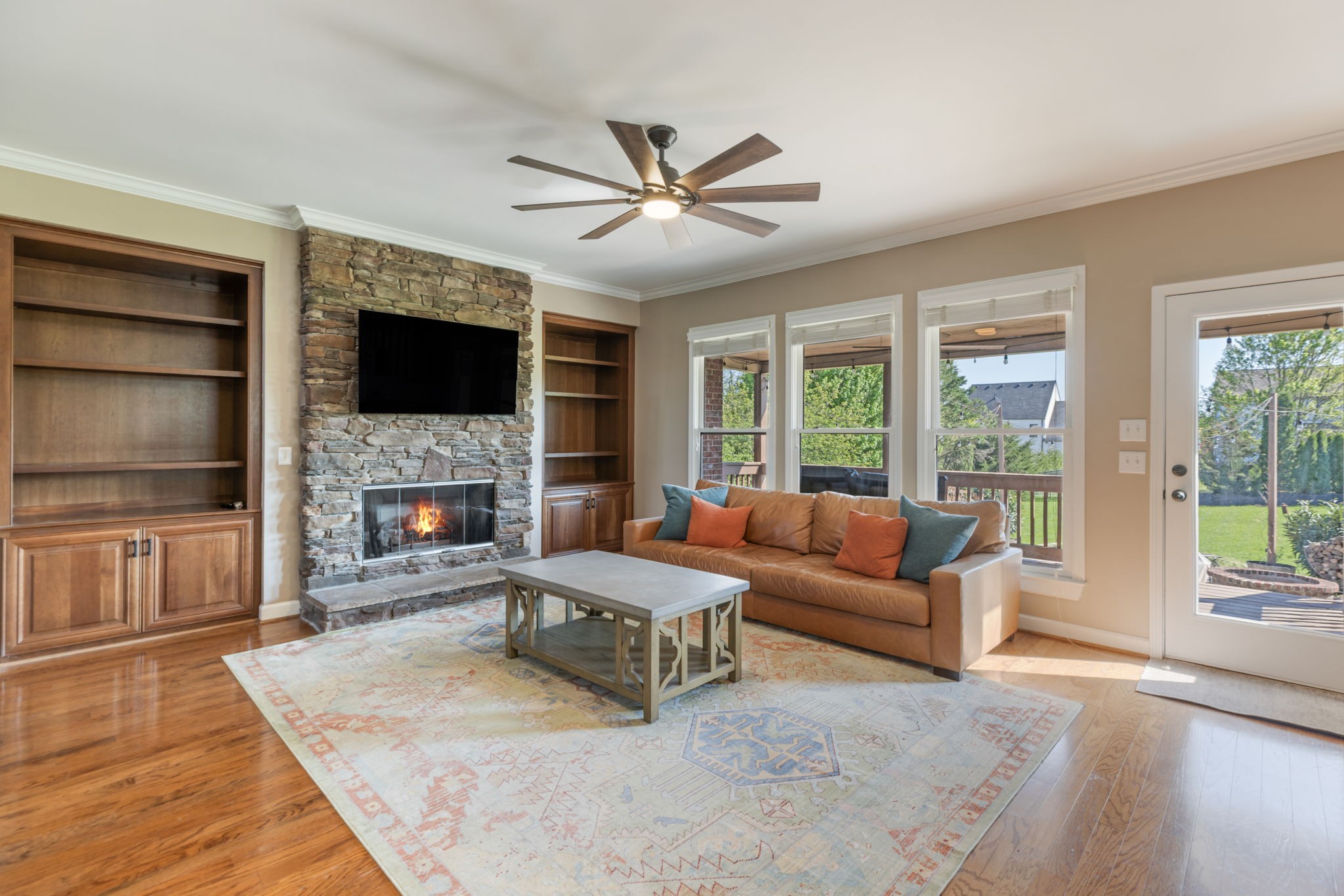 3517 Union Village Road Thompson's Station, TN 37179 - Photo 20 of 94 a living room with furniture a flat screen tv and a fireplace