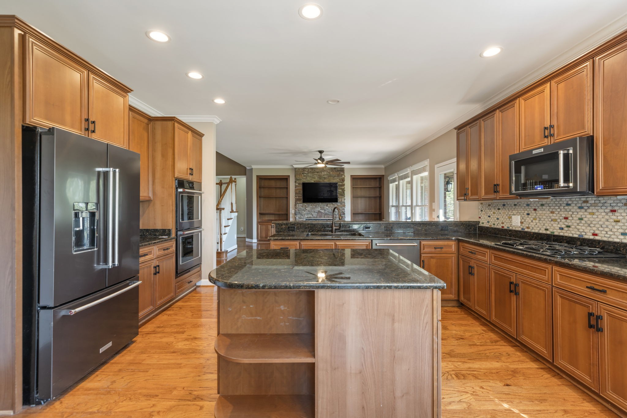 3517 Union Village Road Thompson's Station, TN 37179 - Photo 33 of 94 a kitchen with stainless steel appliances granite countertop a sink a stove top oven a refrigerator and a granite counter tops