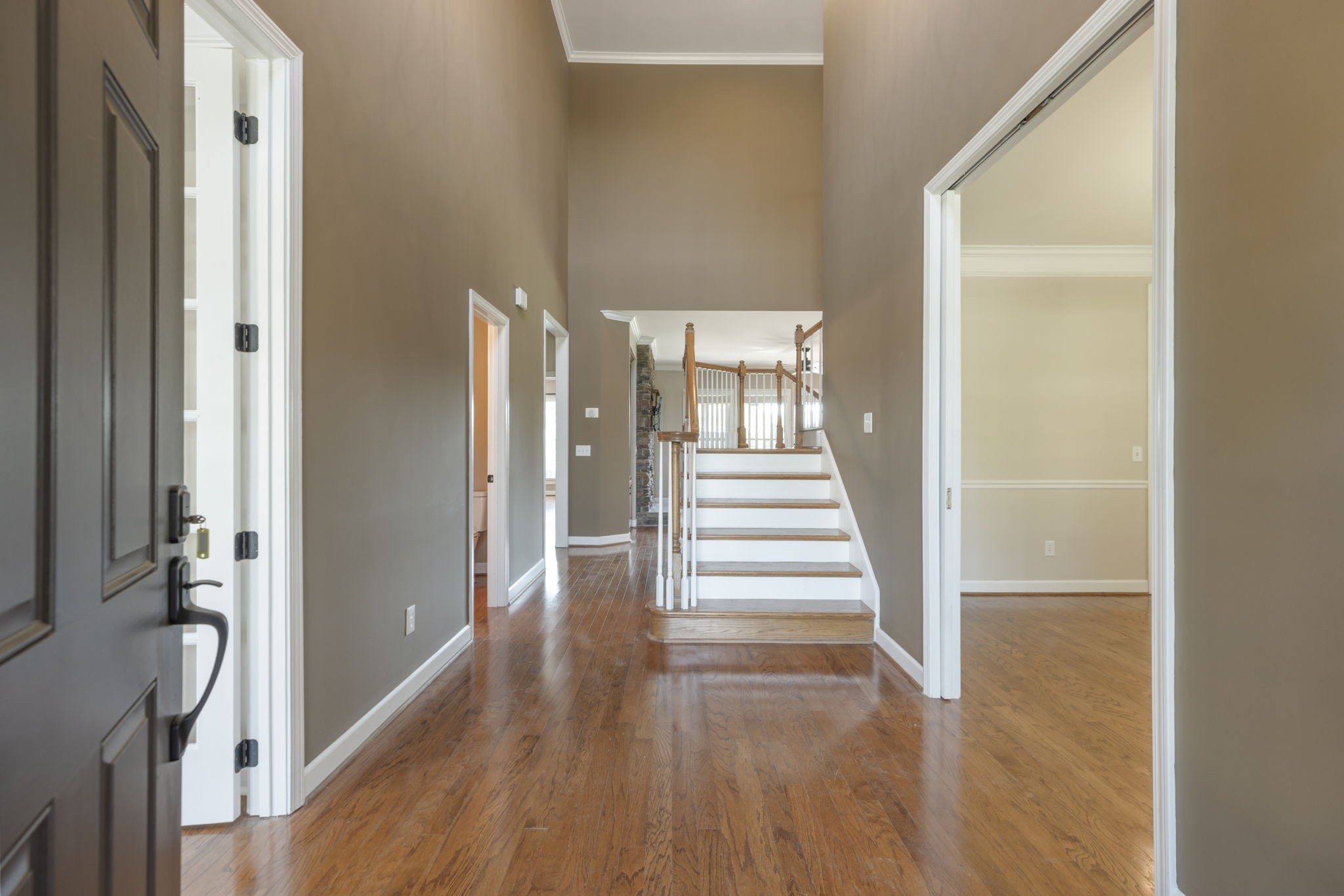 3517 Union Village Road Thompson's Station, TN 37179 - Photo 7 of 94 a view of a hallway with wooden floor and staircase