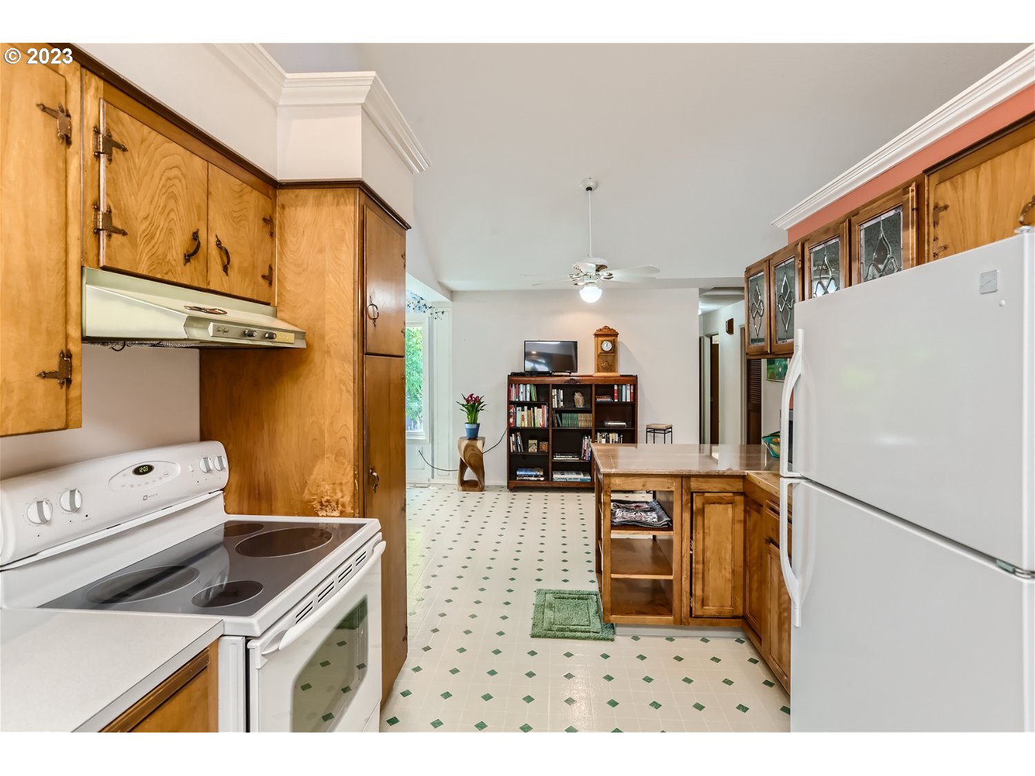 8220 Southwest Taylors Ferry Road Tigard, OR 97223 - Photo 12 of 38 a kitchen with stainless steel appliances granite countertop a refrigerator a stove and a sink