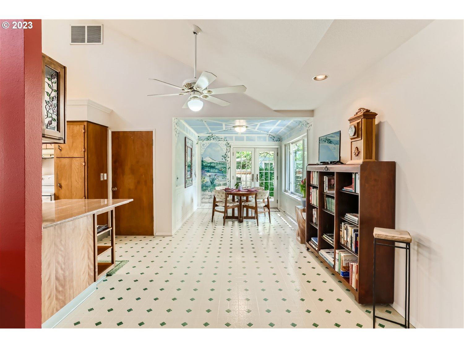 8220 Southwest Taylors Ferry Road Tigard, OR 97223 - Photo 13 of 38 a living room with furniture a chandelier and a dining table