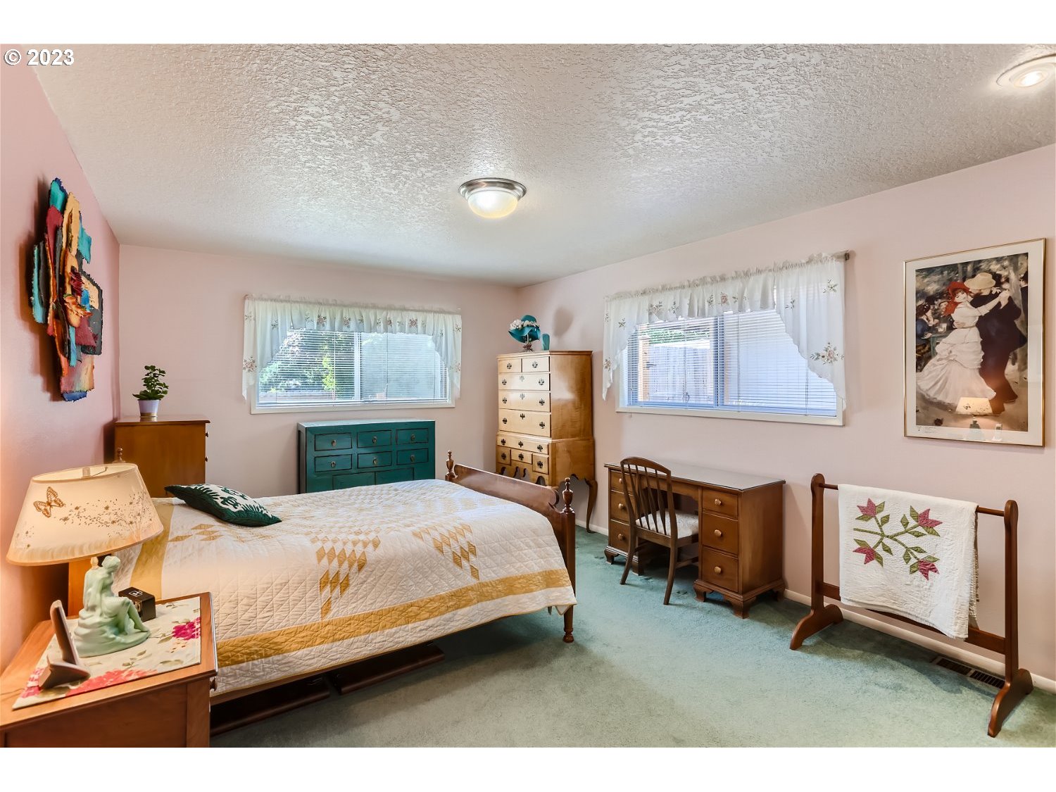 8220 Southwest Taylors Ferry Road Tigard, OR 97223 - Photo 14 of 38 a bedroom with a bed a dresser and next to a window