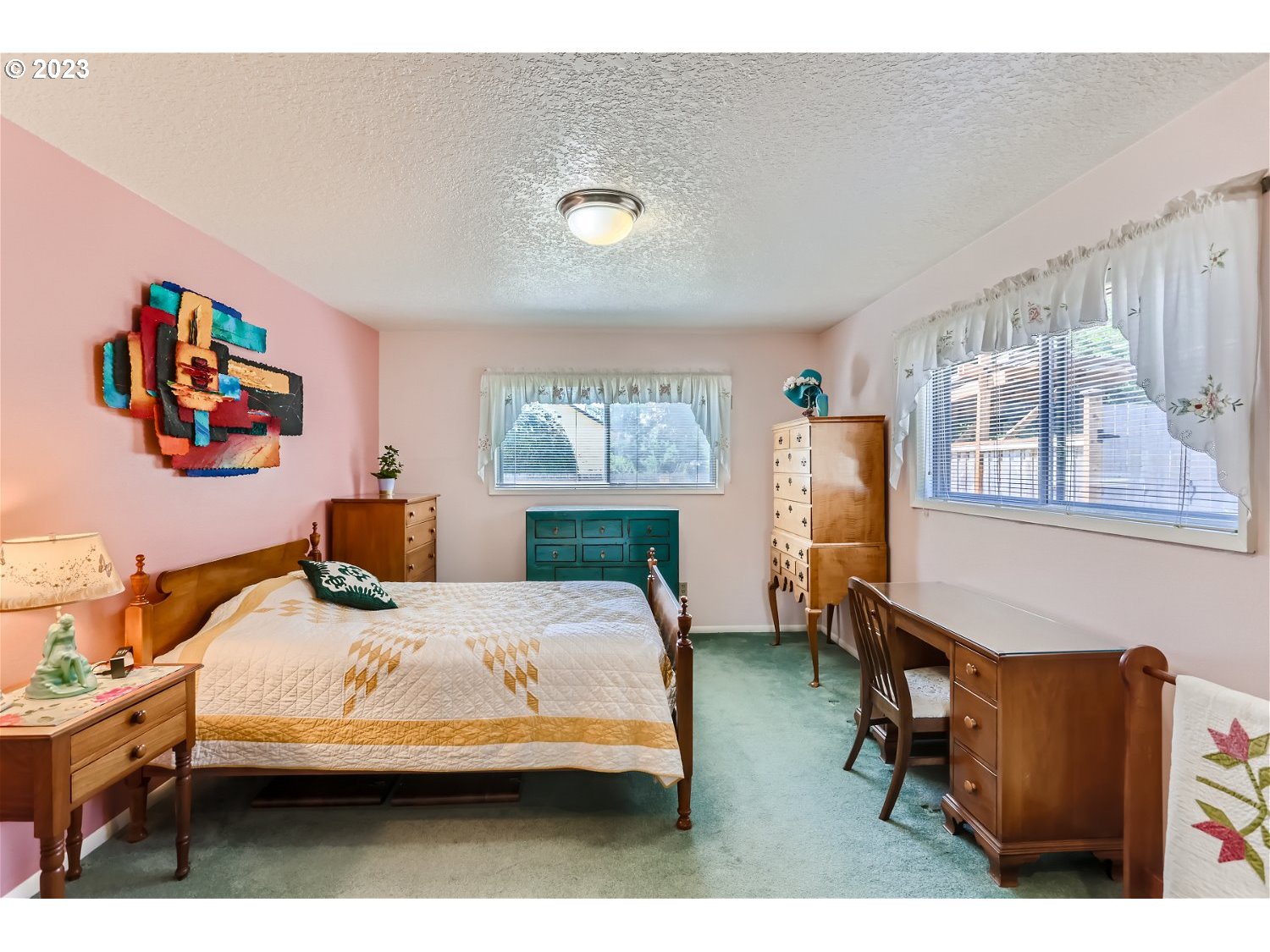 8220 Southwest Taylors Ferry Road Tigard, OR 97223 - Photo 16 of 38 a bedroom with furniture and a wooden floor