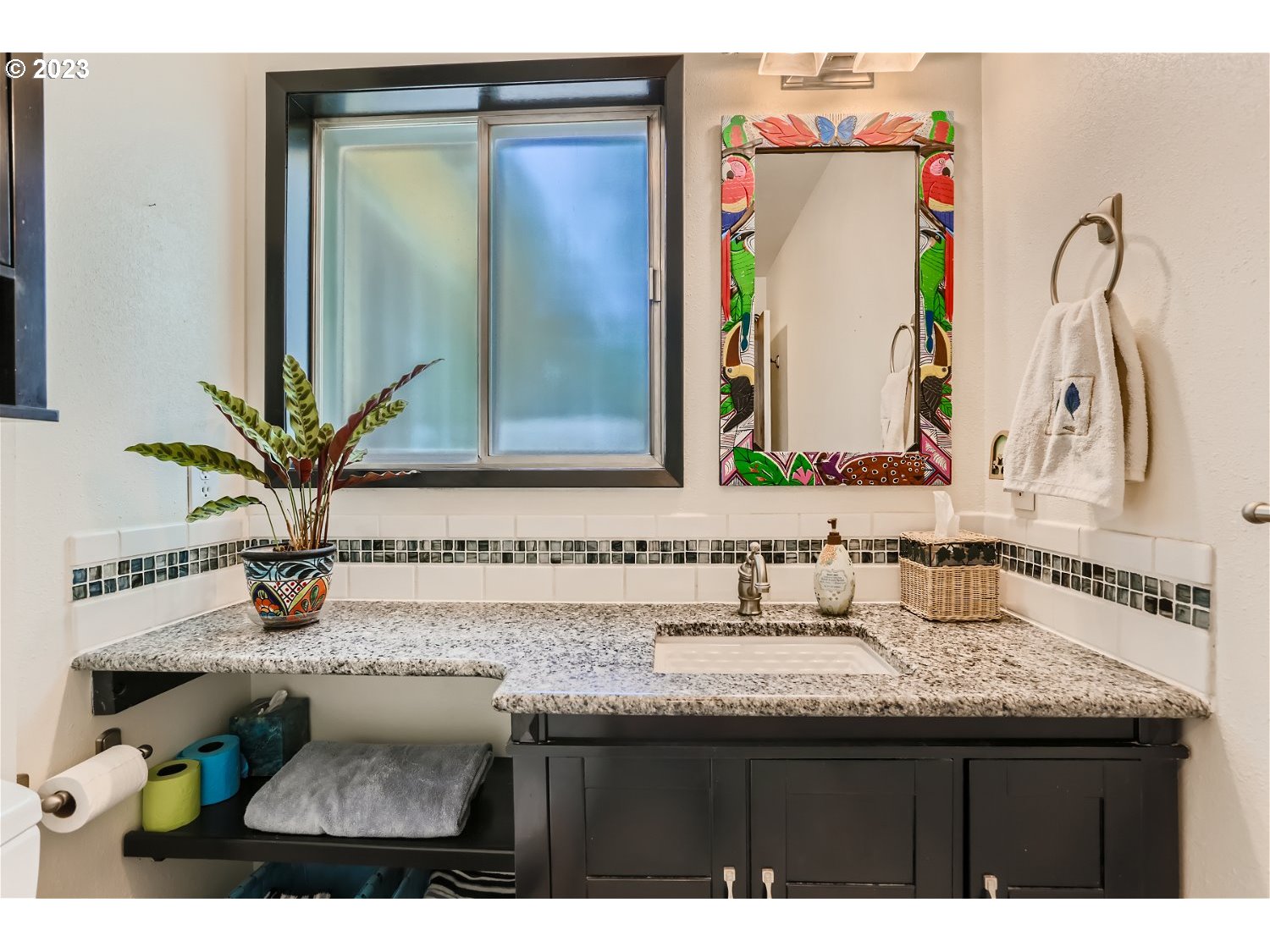 8220 Southwest Taylors Ferry Road Tigard, OR 97223 - Photo 23 of 38 a bathroom with a sink a mirror and a shower