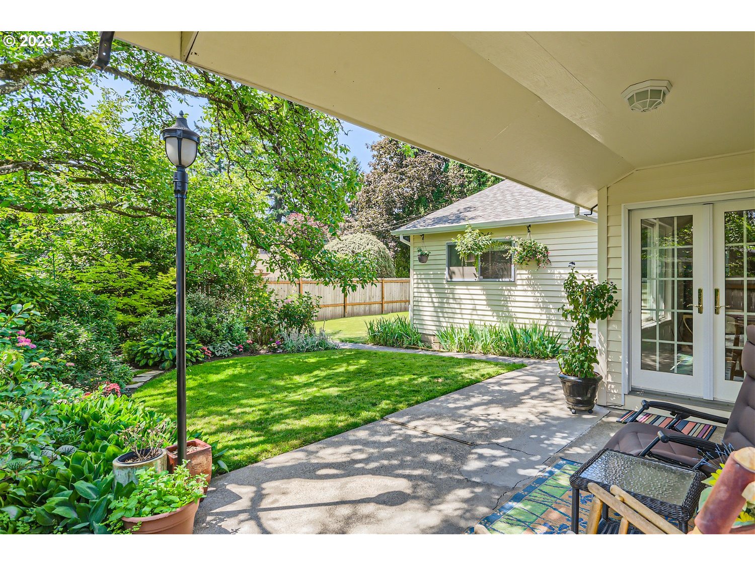 8220 Southwest Taylors Ferry Road Tigard, OR 97223 - Photo 26 of 38 a front view of a house with a yard