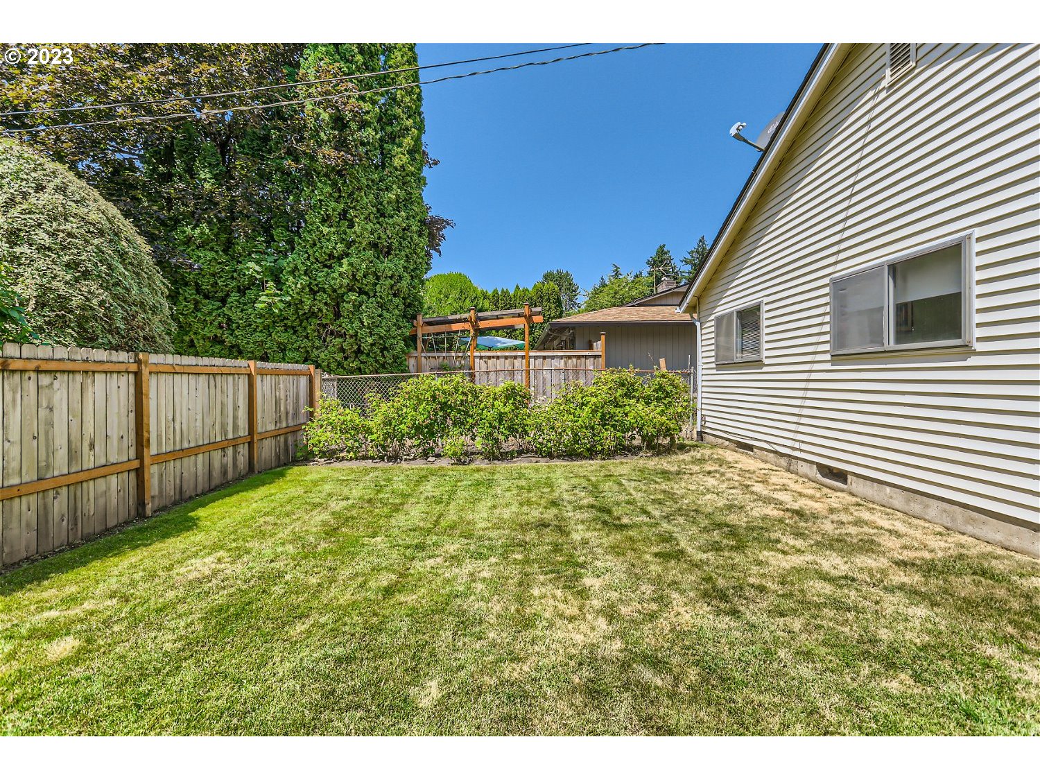8220 Southwest Taylors Ferry Road Tigard, OR 97223 - Photo 27 of 38 a view of a backyard of the house