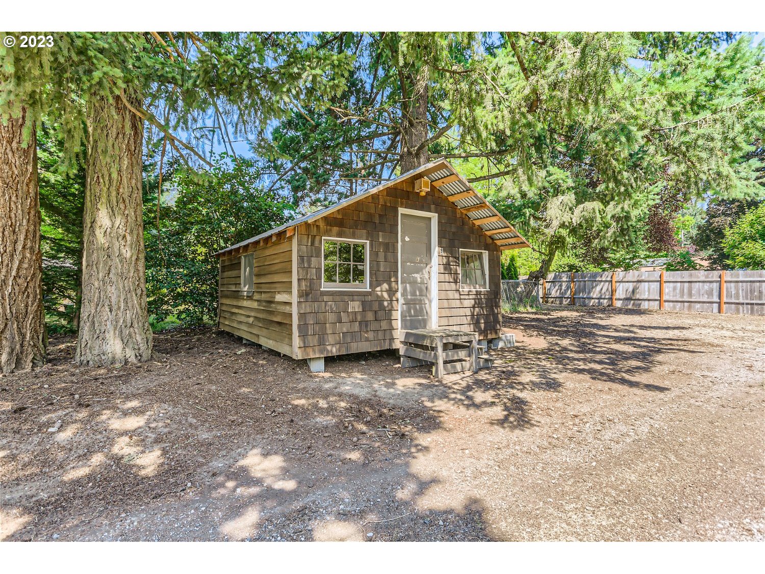 8220 Southwest Taylors Ferry Road Tigard, OR 97223 - Photo 30 of 38 a view of a small house with a yard