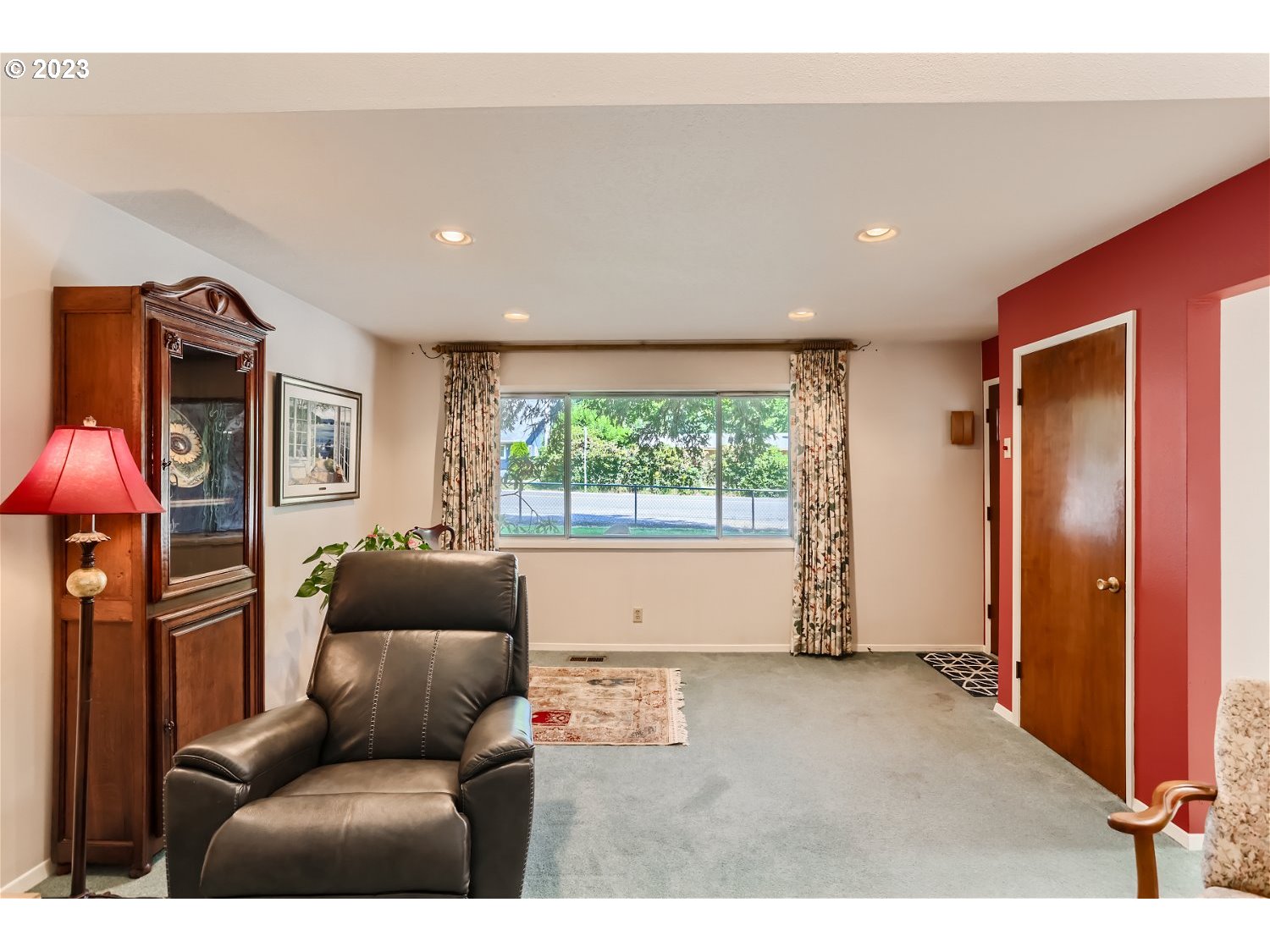 8220 Southwest Taylors Ferry Road Tigard, OR 97223 - Photo 5 of 38 a living room with furniture a window and a flat screen tv