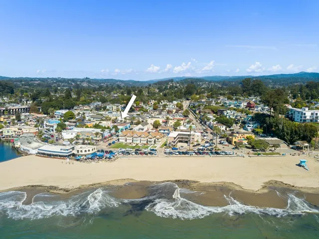 a view of a city with an ocean beach