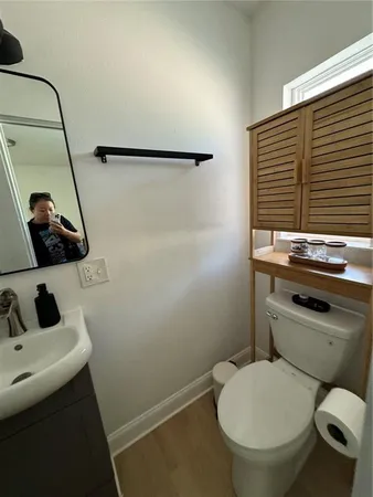 a bathroom with a toilet and a sink