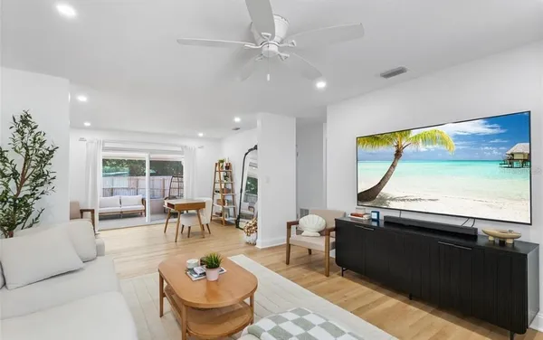 a living room with furniture and a large window