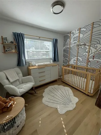 a bedroom with furniture and a window