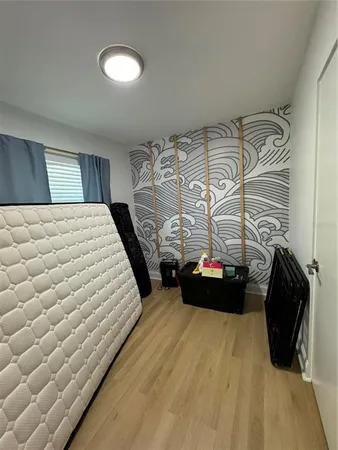 a bedroom with a bed and a walk in closet