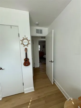 a view of a room with a furniture and wooden floor