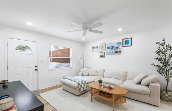 a living room with furniture and a table