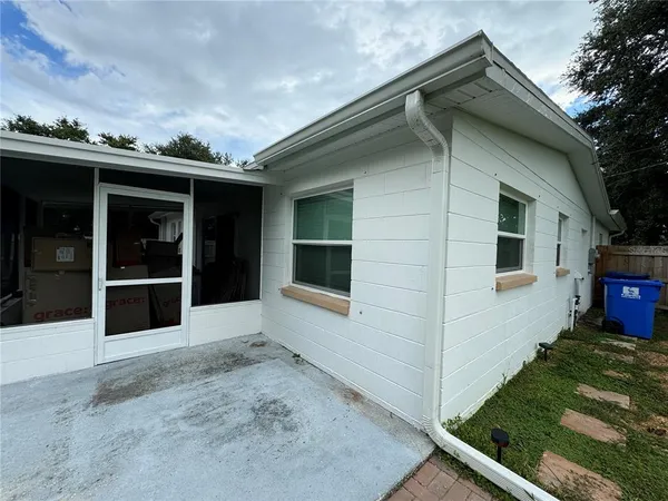 a view of a backyard with plants and a garden