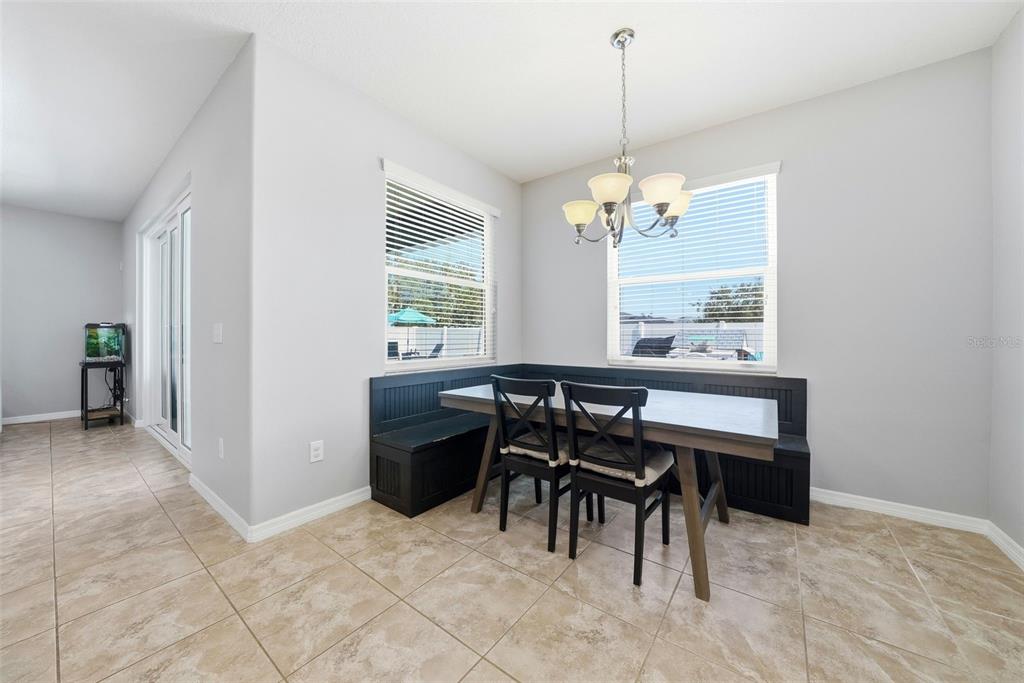 14604 Rannoch Moor Place Wimauma, FL 33598 - Photo 21 of 76 a view of a dining room with furniture and window
