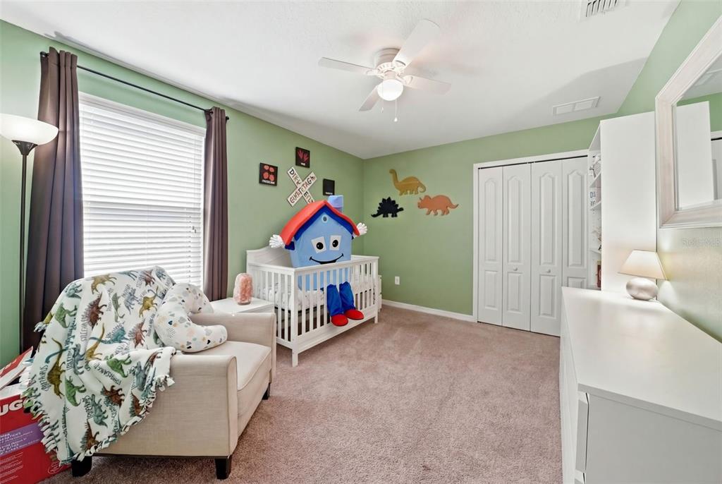 14604 Rannoch Moor Place Wimauma, FL 33598 - Photo 50 of 76 a bedroom with furniture and a large window