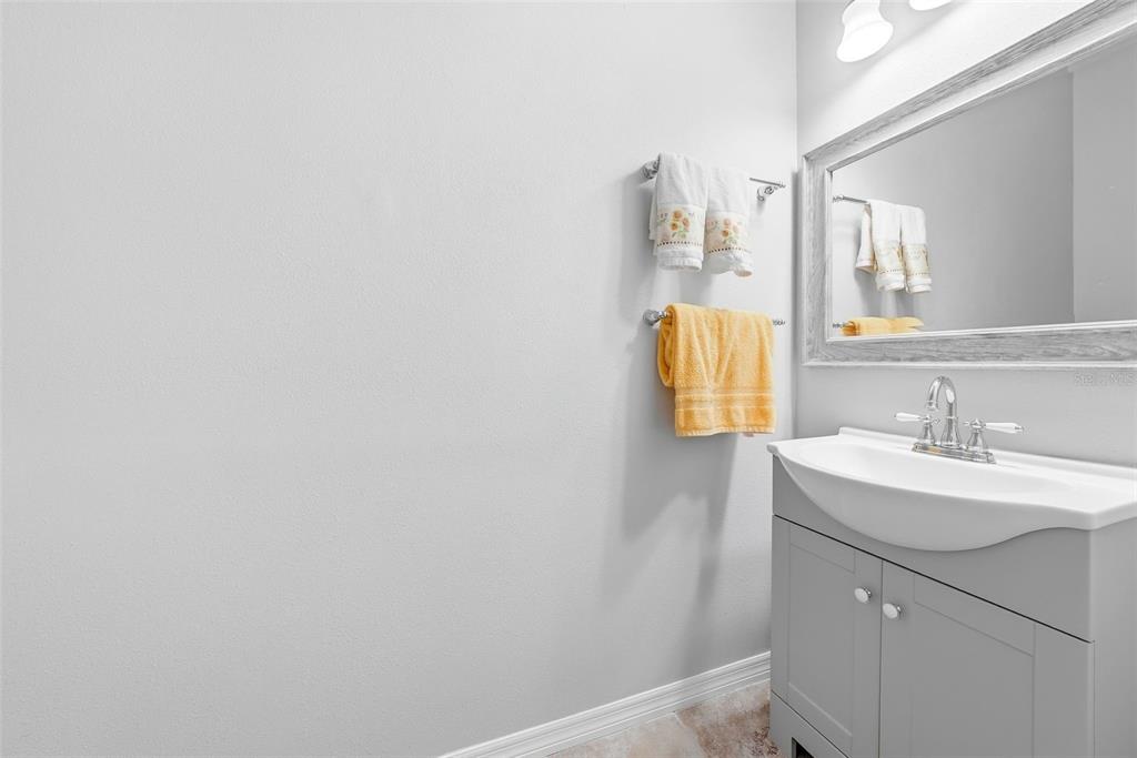 14604 Rannoch Moor Place Wimauma, FL 33598 - Photo 55 of 76 a bathroom with a sink and a mirror