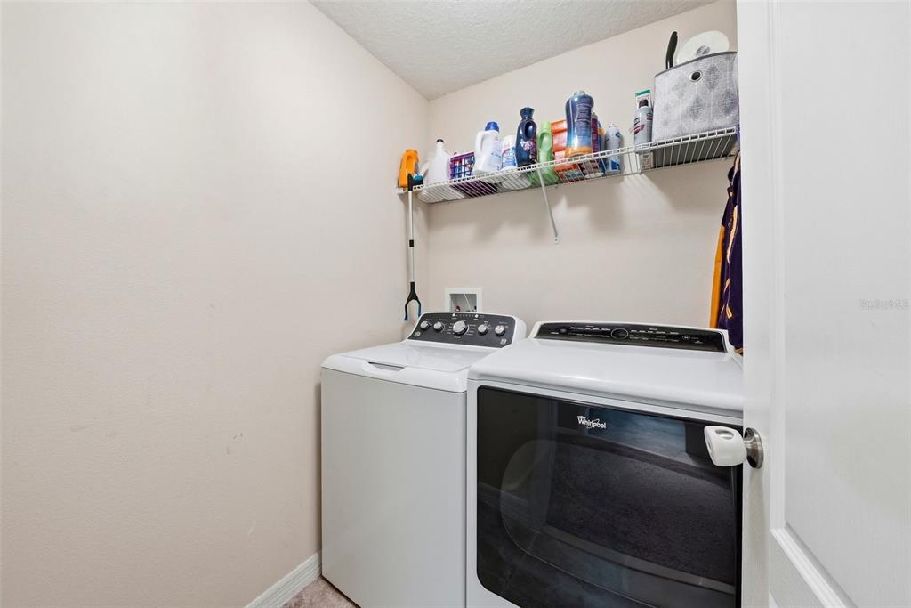 14604 Rannoch Moor Place Wimauma, FL 33598 - Photo 56 of 76 a utility room with dryer and washer