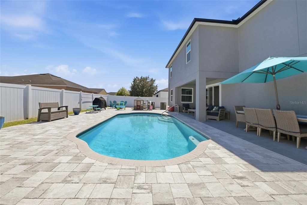 14604 Rannoch Moor Place Wimauma, FL 33598 - Photo 60 of 76 a view of a house with swimming pool in front of it