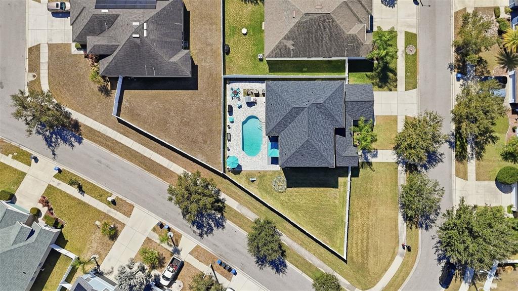 14604 Rannoch Moor Place Wimauma, FL 33598 - Photo 67 of 76 an aerial view of a house with large trees
